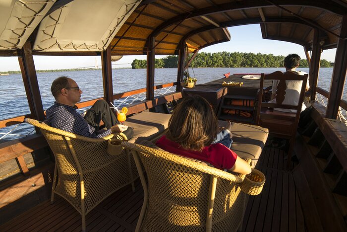 Profitez de la vue sur le fleuve Mékong lors d'un voyage en bateau