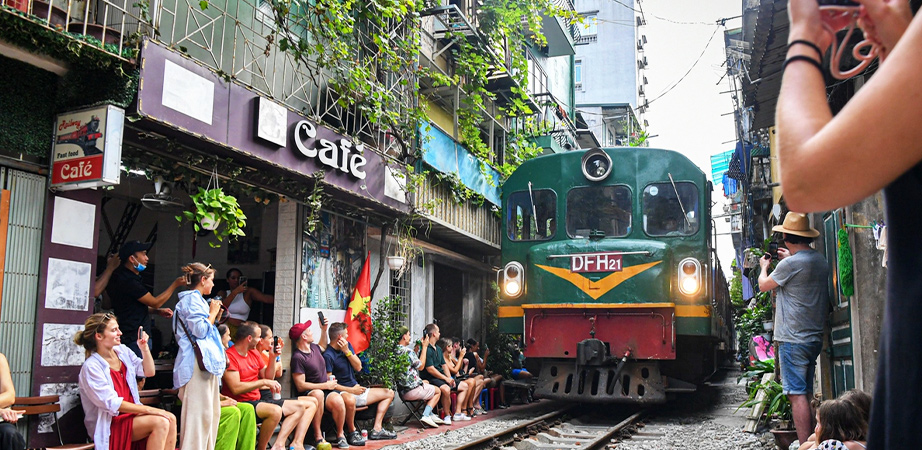 The train passes through the heart of Hanoi